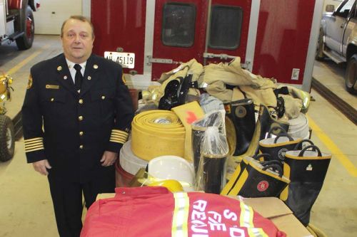 North Frontenac Fire Chief Eric Korhonen with a load of “very gently used” firefighting gear on its way to Bolivia. Photo/Craig Bakay